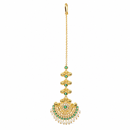 A gold-toned traditional Indian maang tikka earring with green stone accents and a row of dangling white pearls, shown against a plain white background.

