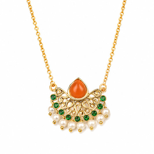 Gold-tone pendant necklace featuring a teardrop-shaped orange stone, green rhinestones, and dangling white faux pearls on a delicate chain, set against a plain white background.

